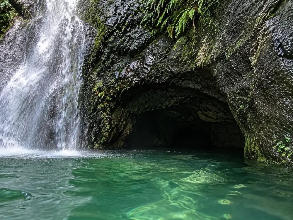 The mouth of the submerged cave on the right-hand side of the lower fall